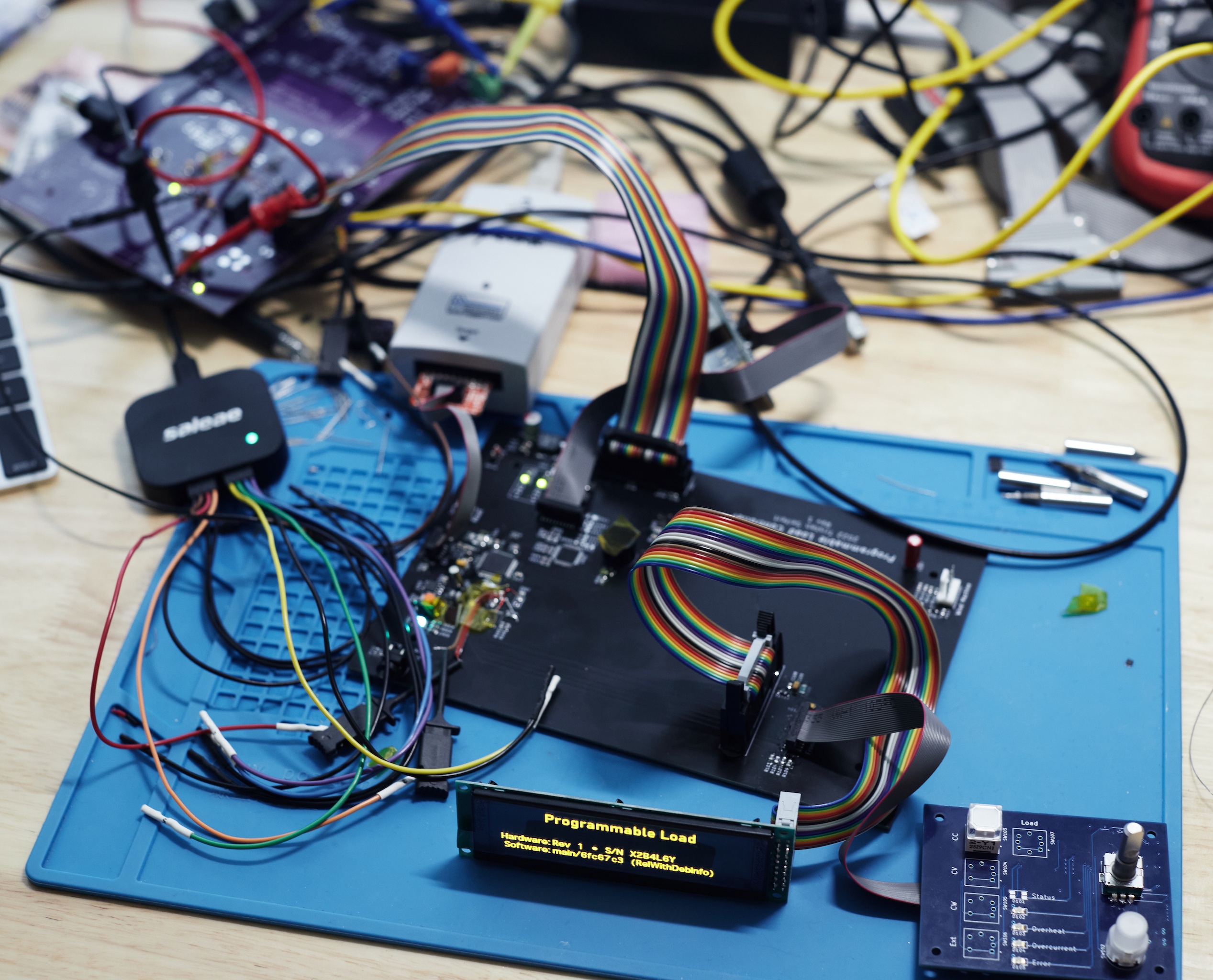 Photo of the various programmable load PCBs on a workbench.
